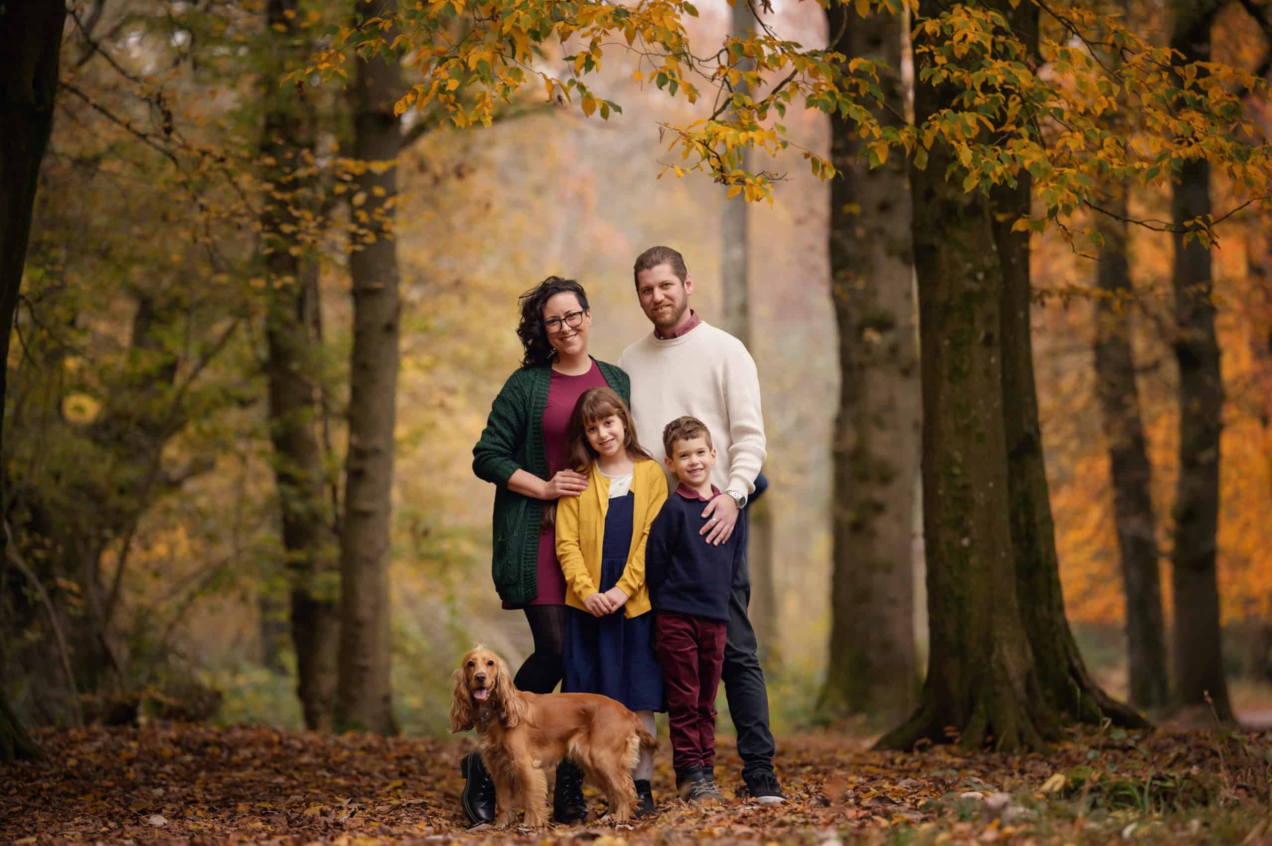 family photo in autumn woodland