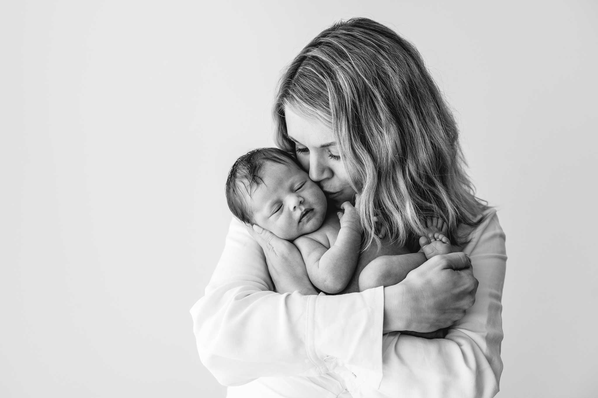 black & white photo of mother and newborn